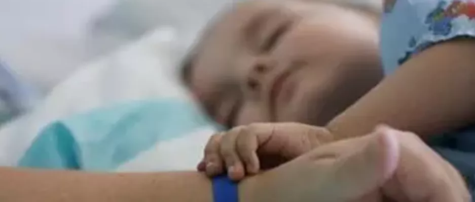 A little child kidney patient holding a hand