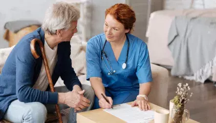 A nurse talking to a patient