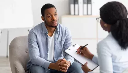 Female nurse talking to patient