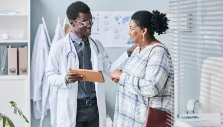 A doctor talking to a female patient