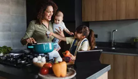 Mom with kids around the kitchen counter
