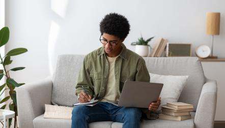 Young black man using a laptop