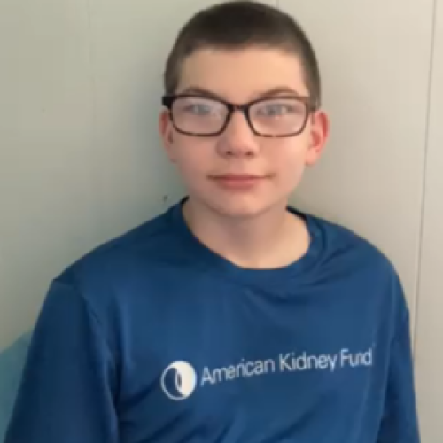 Trystian wearing a blue American Kidney Fund t-shirt