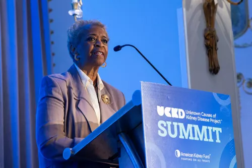 LaVarne A. Burton speaking at a podium at the UCKD Summit