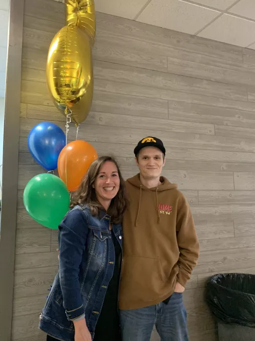 Beth Burbridge and Jackson in front of a balloon