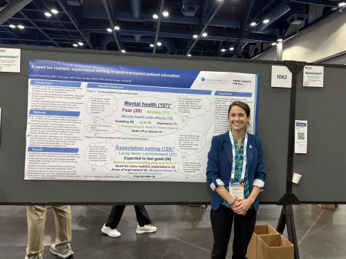 Lauren Andracchio standing in front of a poster at the 2025 ASN annual meeting