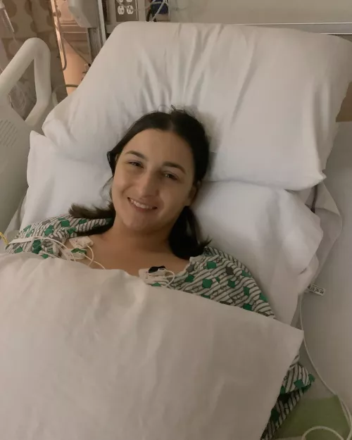 Michelle Farley lying in a hospital bed after her kidney transplant