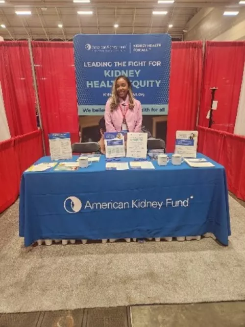 AKF staff at exhibit booth