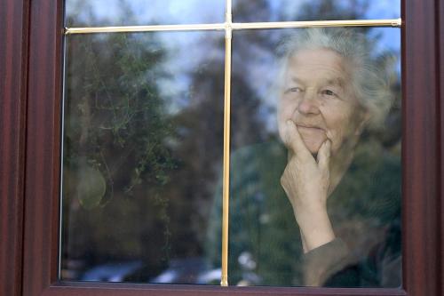 elderly woman in window