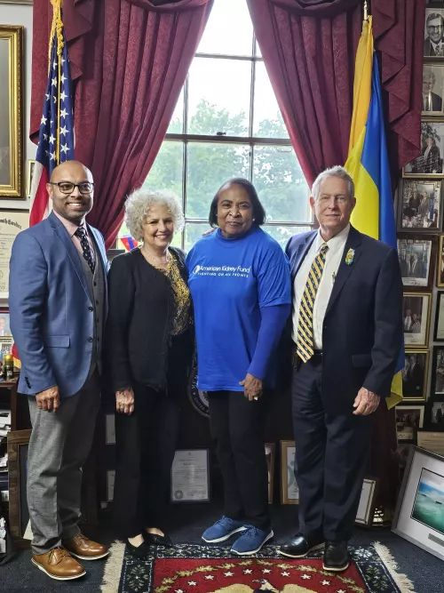 AKF staff and Ambassador with legislator