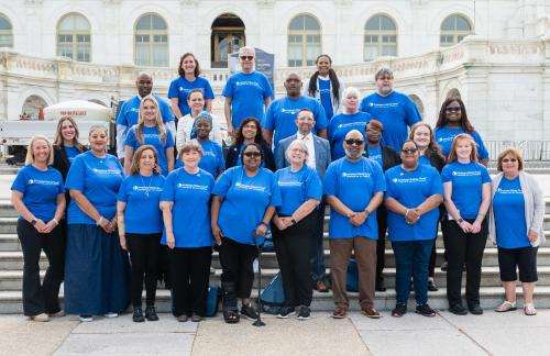 AKF Ambassadors standing on the steps in front of the Capitol building