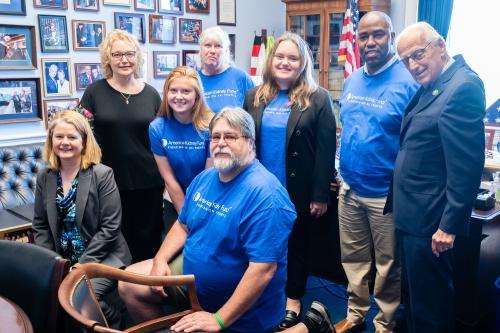 AKF Ambassadors and staff posing with an elected official in their office
