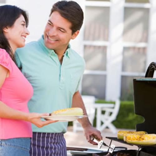 picture of couple at an outside grill