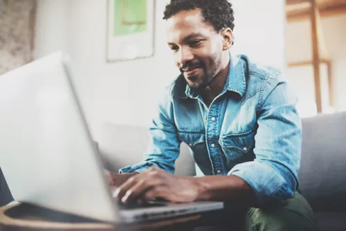 Man typing on laptop