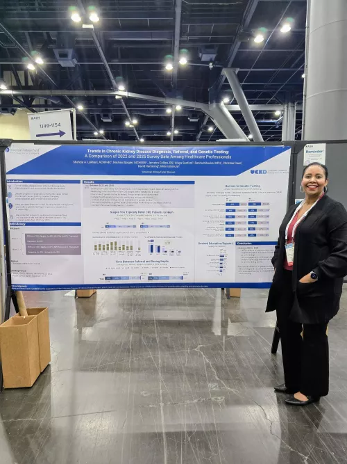 Jemetra Collins standing in front of a poster at ASN 2025