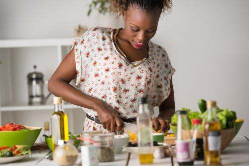 Young  woman cooking healthy food