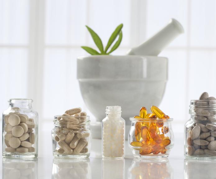 alternative medicine pills in bowls