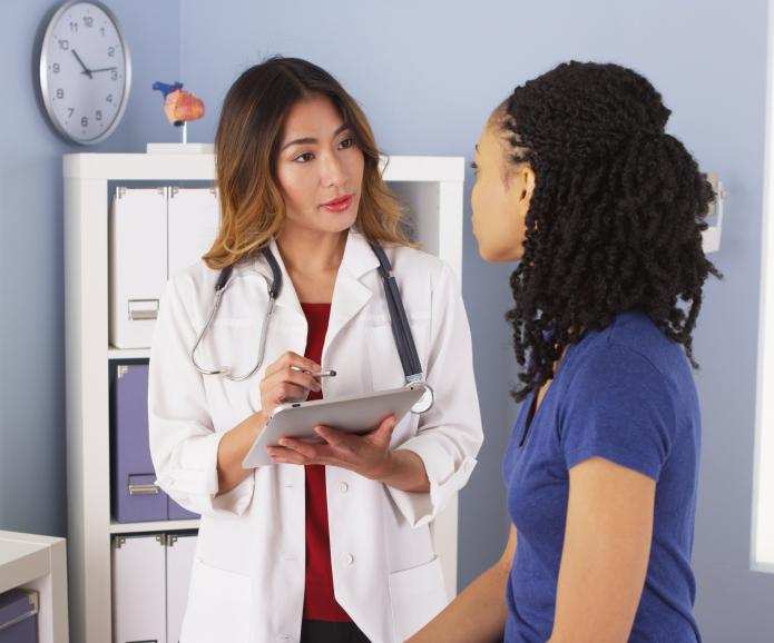 asian doctor explaining chart to patient 2