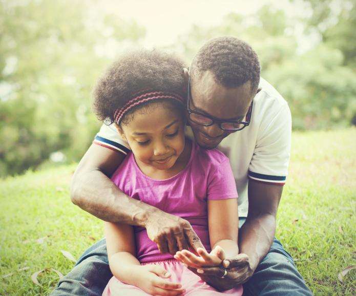 black dad young daughter park shutterstock 553350997