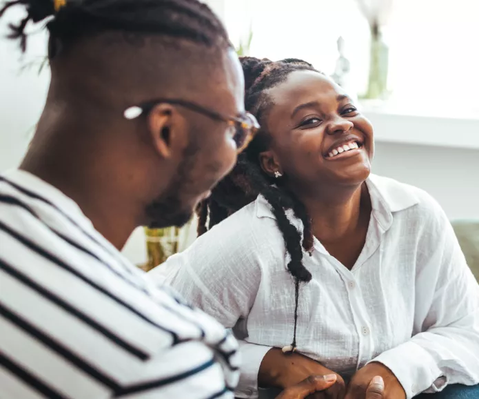 A young black couple smiling