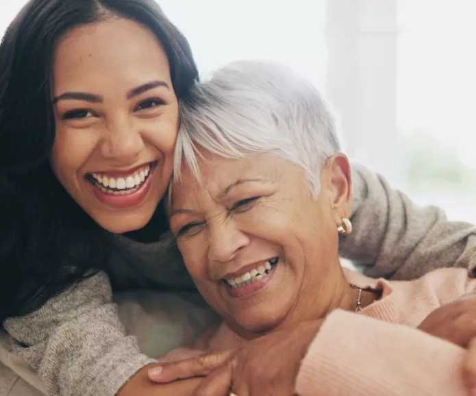 A daughter hugging her mother