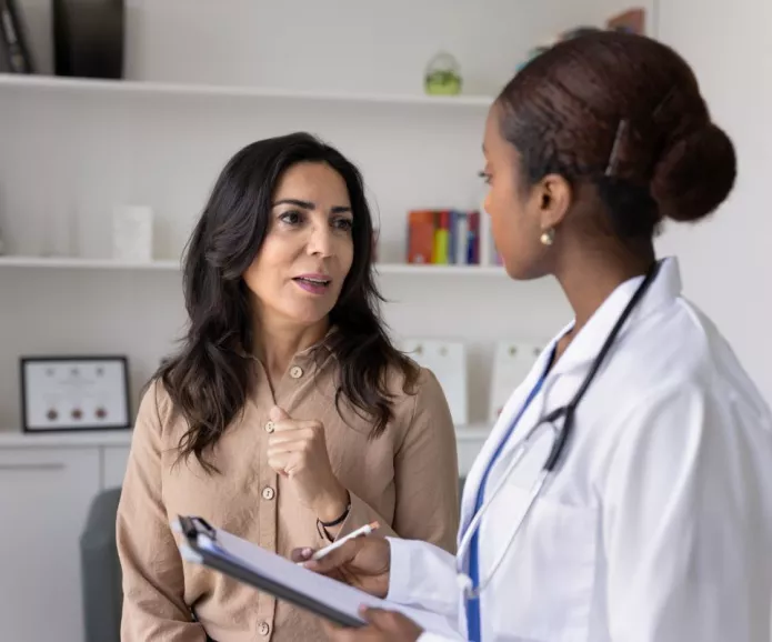 A female doctor talking to her patient