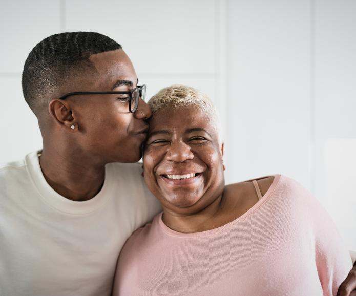 Young man with mom smiling