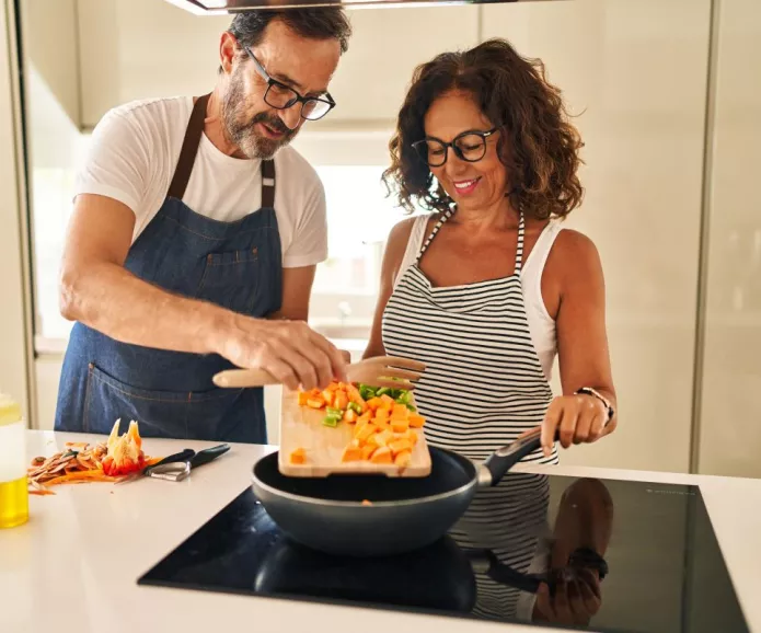 Two people cooking