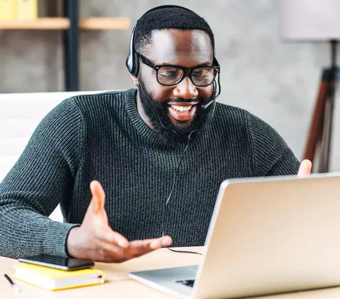 Black man attending a virtual meeting
