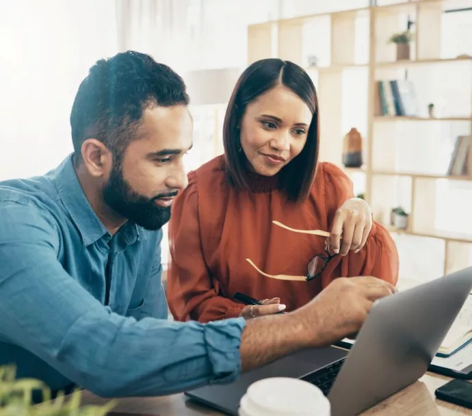 A couple looking at a laptop