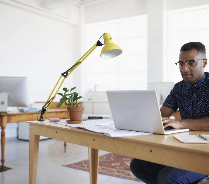 young black man in coworking space