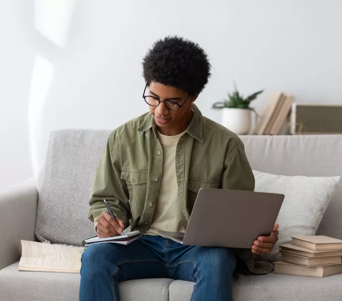 Young black man using a laptop