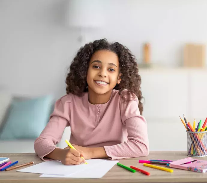 A young girl creating artwork