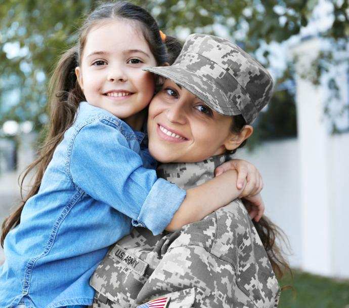Woman in Army uniform and child