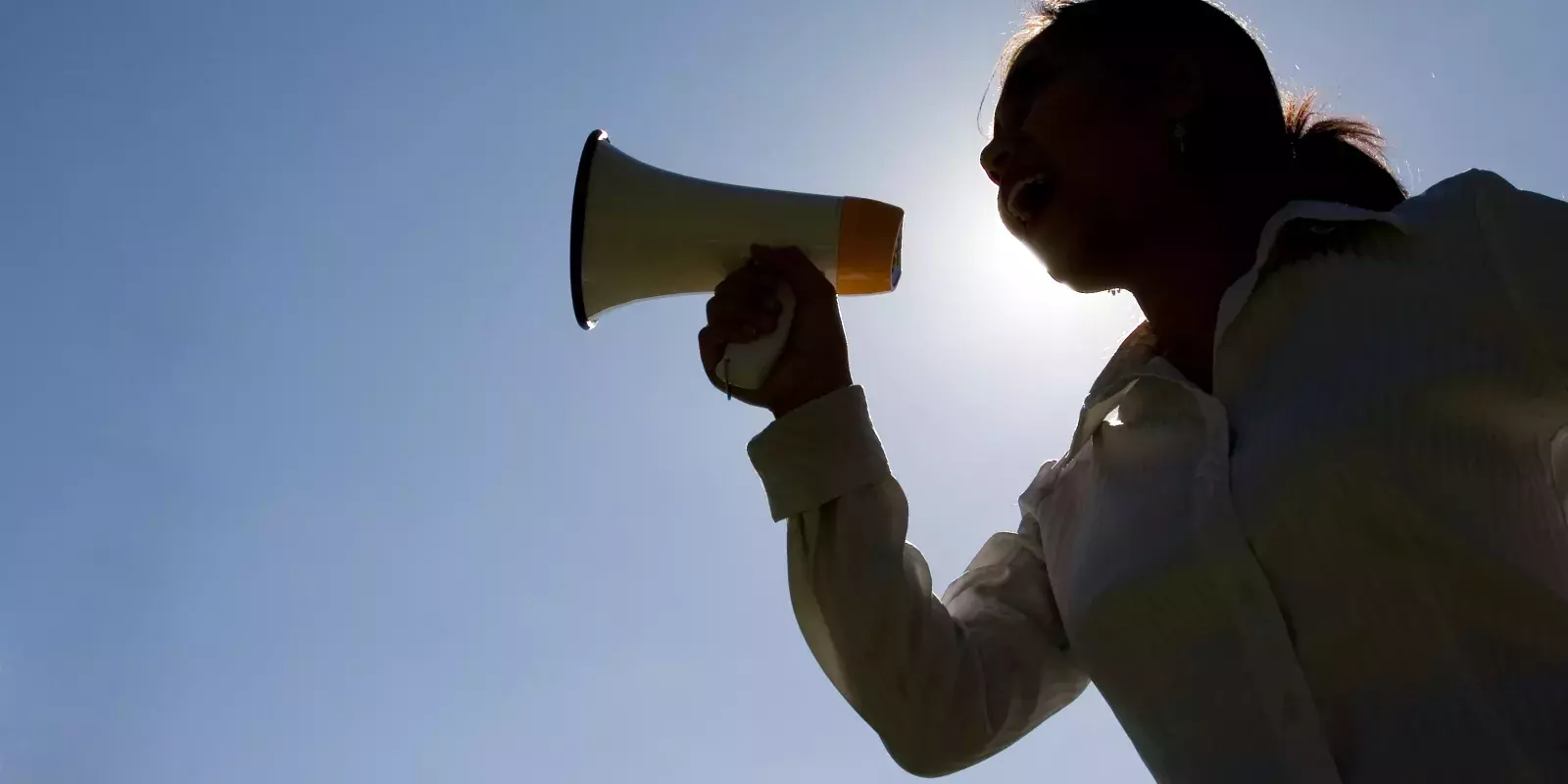 woman shouting megaphone silhouette
