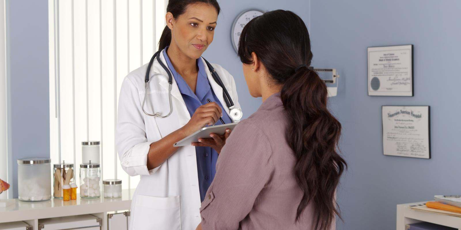 woman doctor explaining chart to patient