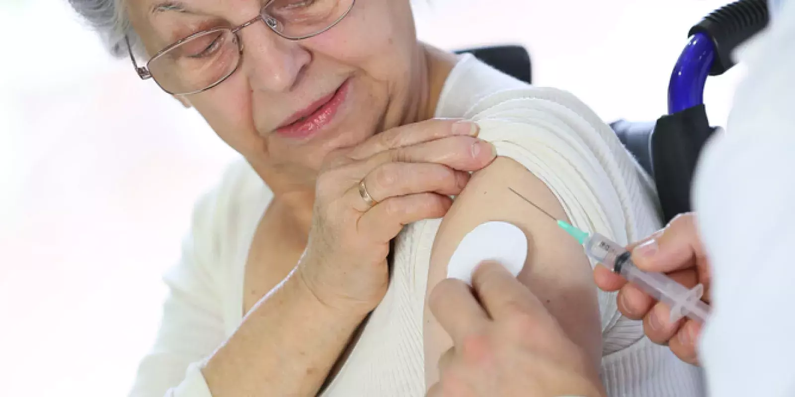 woman getting flu shot no masks