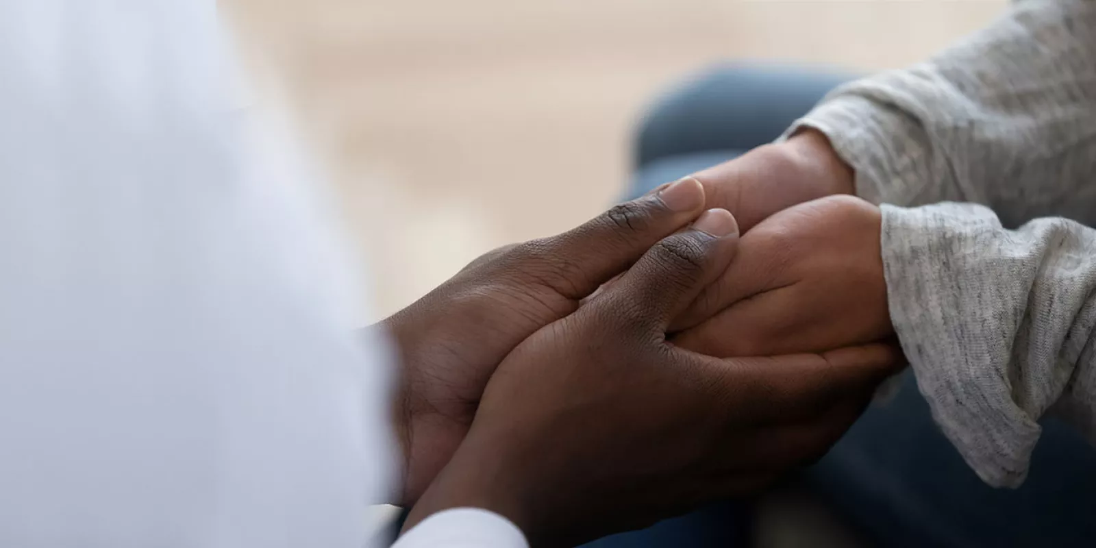 Two people holding hands