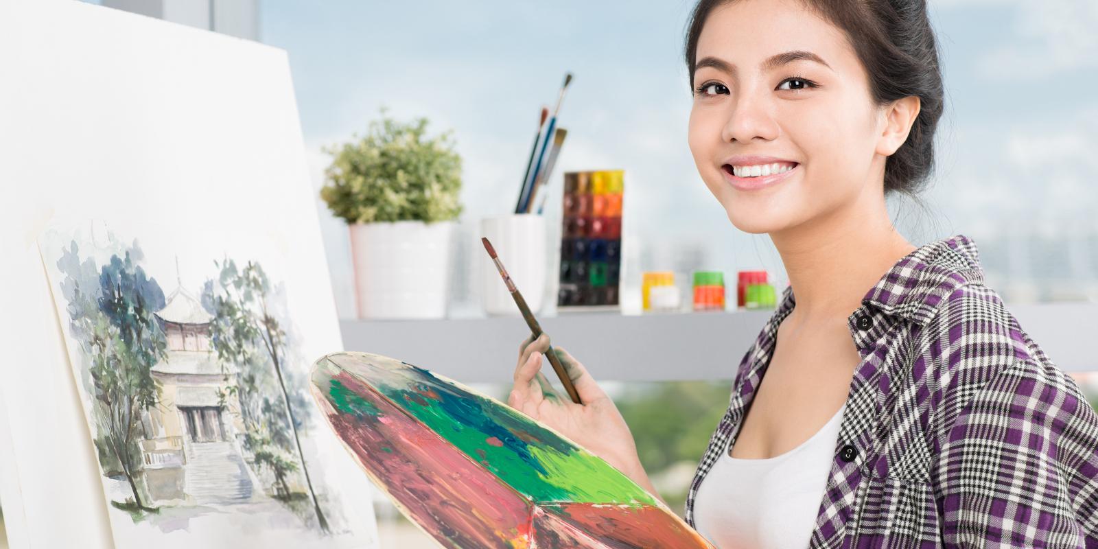 young asian woman painting shutterstock 189083873  1
