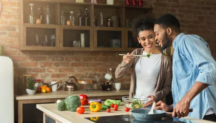 black couple sharing food chopsticks
