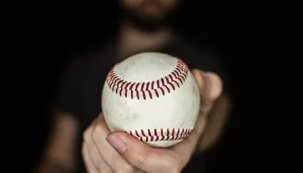 man holding baseball