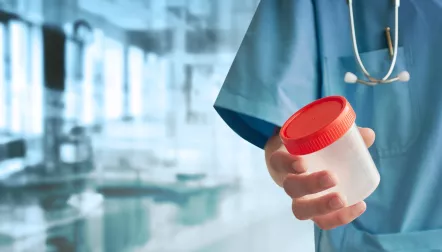 urine test nurse holding cup shutterstock 2920619961