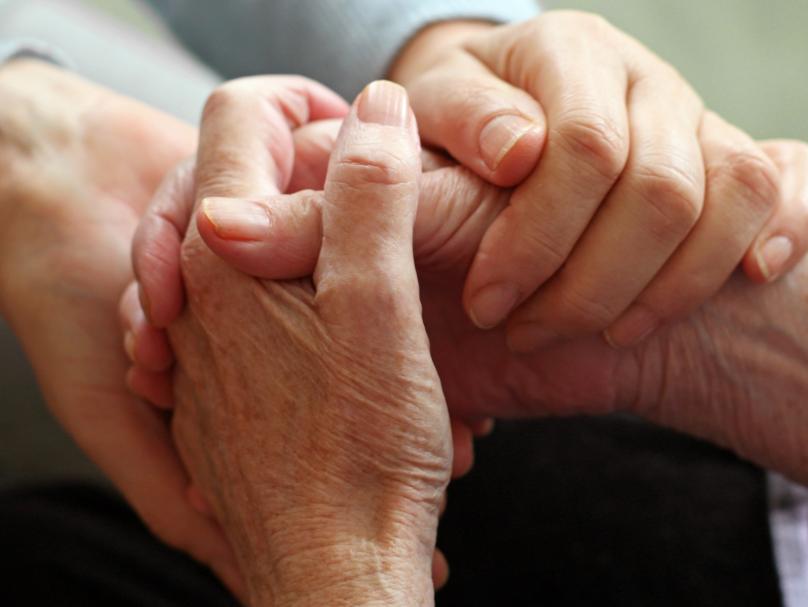 elderly hands holding eachother